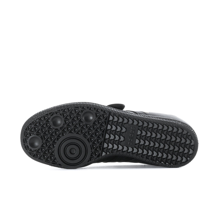 Black rubber outsole with textured tread pattern and circular grip detail