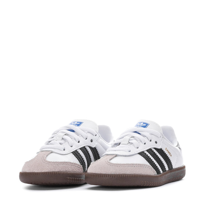 Toddler lace-up sneakers in white with black stripes and gum soles, pair view.