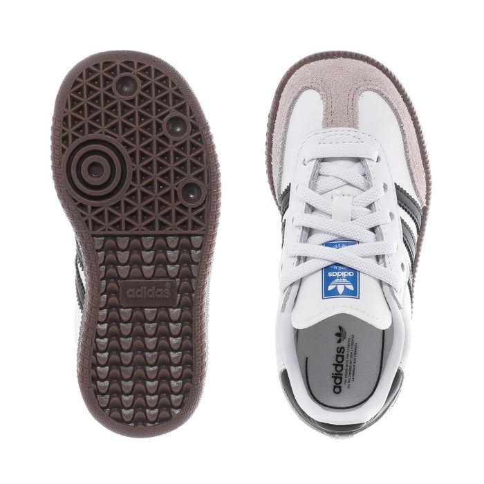 Toddler sneakers showing rubber outsole tread and adidas-printed heel collar.
