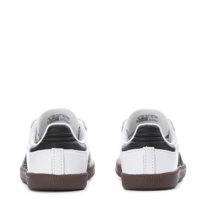 Toddler sneakers with white heel backs, gum trim, and dark lining.