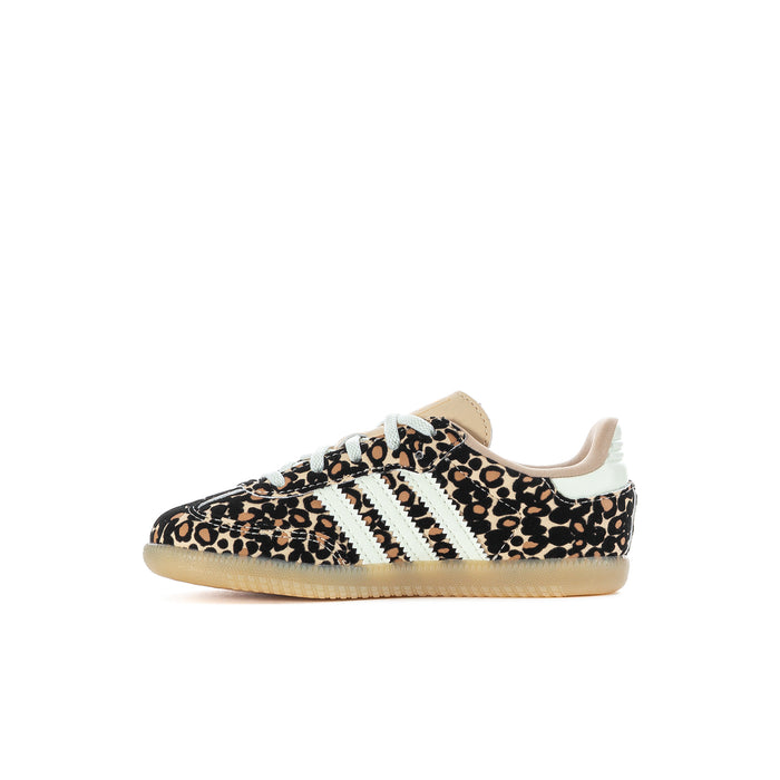 Toddler low-top sneaker with leopard print upper, white adidas stripes, front angle