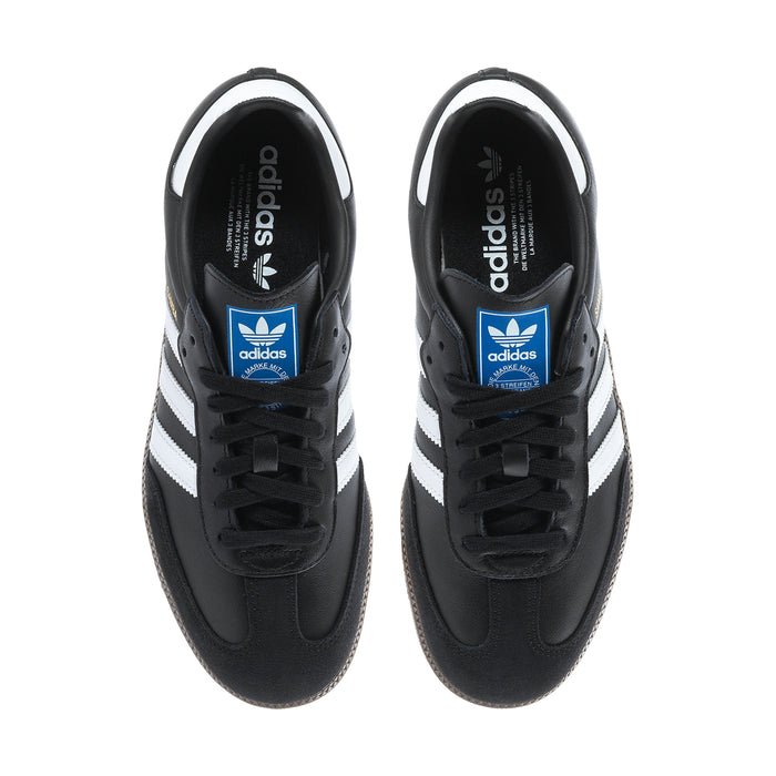 Black adidas sneakers, tongue logo with blue label; lace-up view
