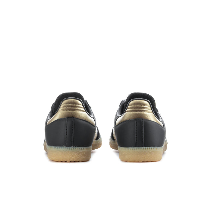 Samba OG women's sneakers rear view, black heel with gold accents and gum sole