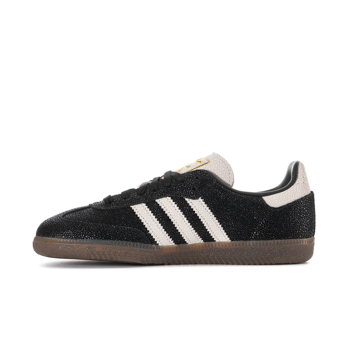 Black Adidas Samba OG sneaker with white stripes, lace-up front, and gum sole