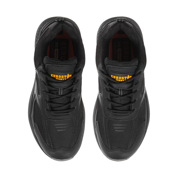 Black womens sneakers, top view showing padded tongue with orange brand mark