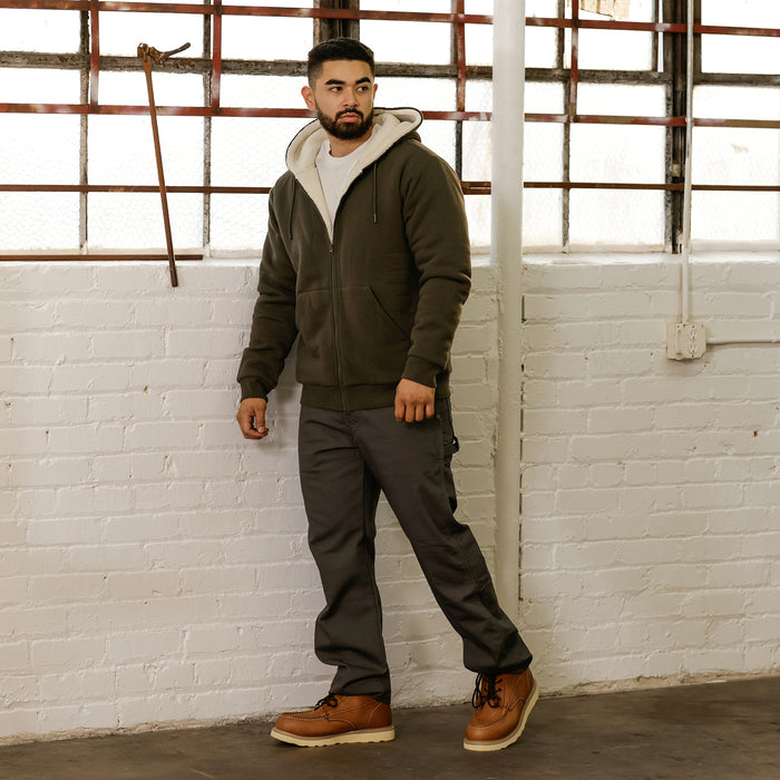 Men's olive sherpa-lined full-zip hoodie on model, front view with zipper