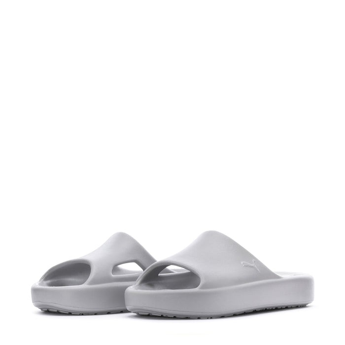 Pair of youth slide sandals in light gray, side view showing two straps.