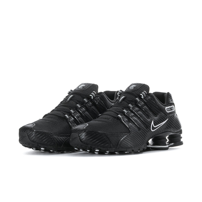 Men's black Nike sneakers, side view, swoosh and Shox-style pods