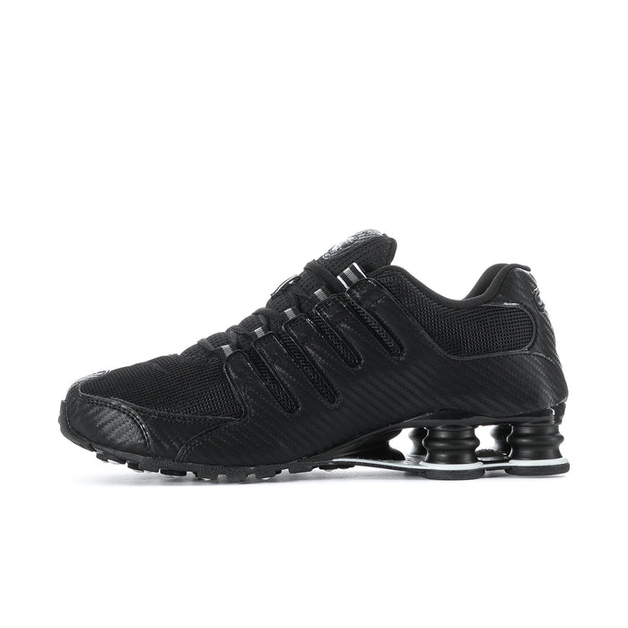 Men's black Nike sneakers with textured upper, lace-up, and Shox-style pods