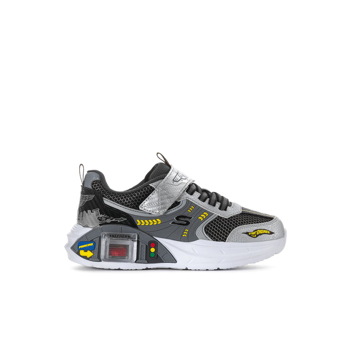 Kids black-and-white mesh sneakers with gray panels, laces, and hook-and-loop strap.