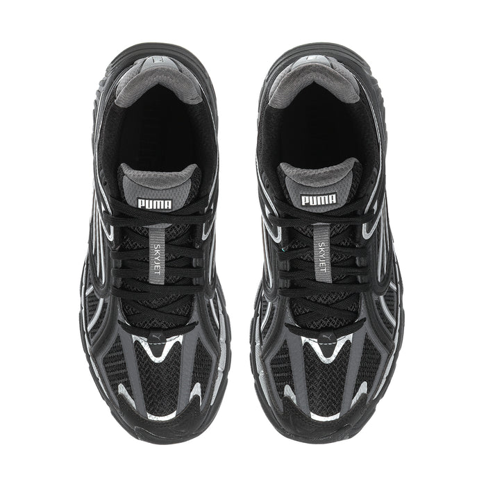 Women's black running shoes with PUMA label at tongue and lace-up upper