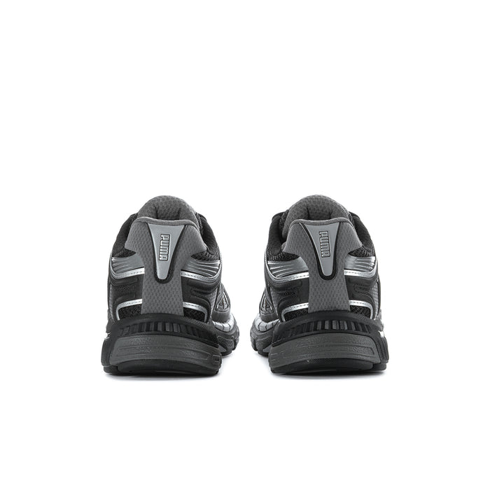 Women's black running shoes with cushioned heel and rear logo detail