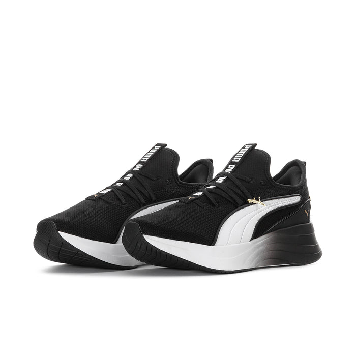 Black and white women's sneakers with white PUMA formstripe and thick sole