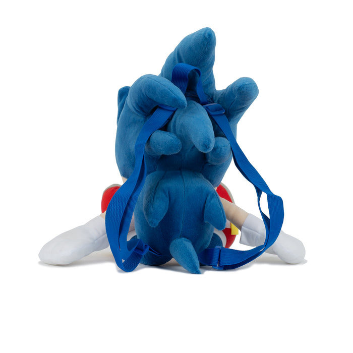 Blue plush backpack with character back and carrying strap loop, lying rear view