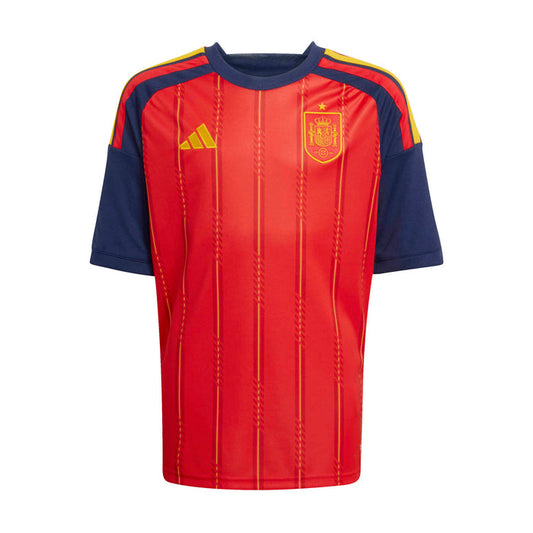 Youth football jersey front, red with navy sleeves, yellow accents, Spain crest