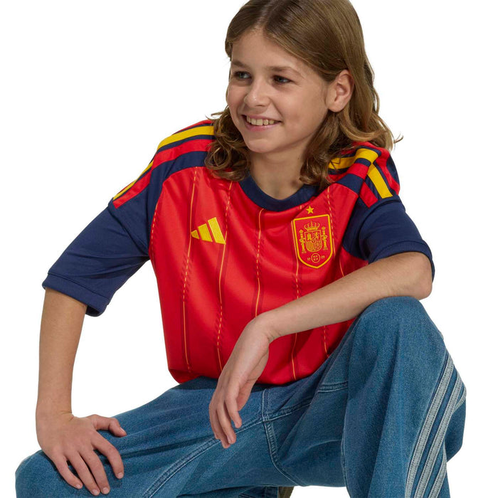 Youth football jersey red with navy sleeves, yellow shoulder stripes and Spain crest