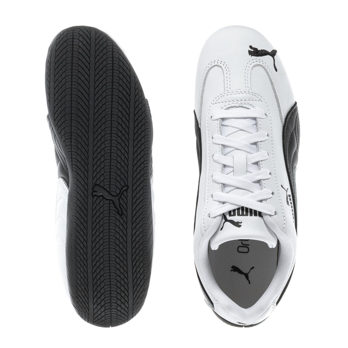 Women's white leather sneaker with black outsole tread and lace-up toe view