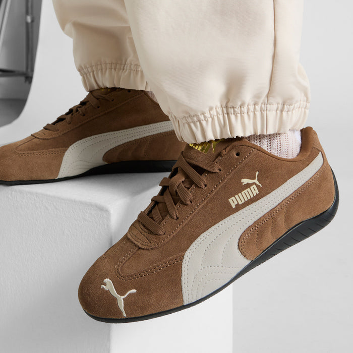 Brown suede sneaker, PUMA on tongue and heel, white midsole stripe