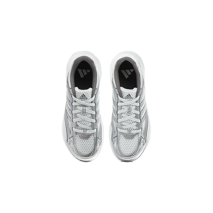 Pair of grey kids sneakers viewed from front, with lace-up vamp and dark lining