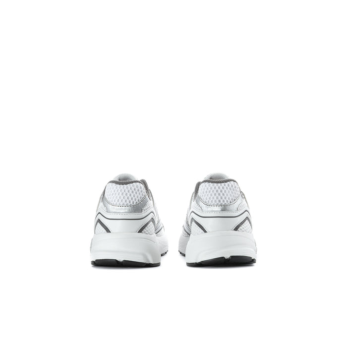 Pair of grey kids sneakers from the back, showing heel tabs and light sole