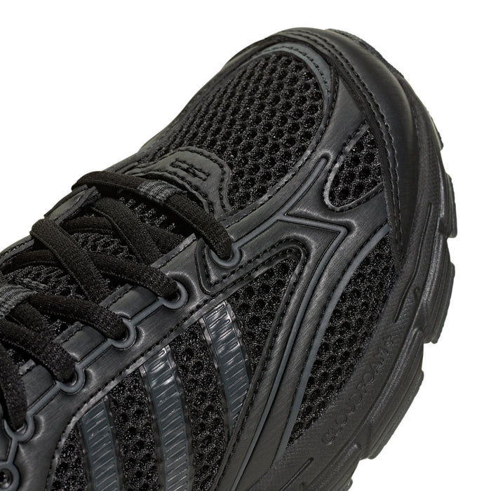 Youth black sneaker upper close-up with mesh panels and lace detail