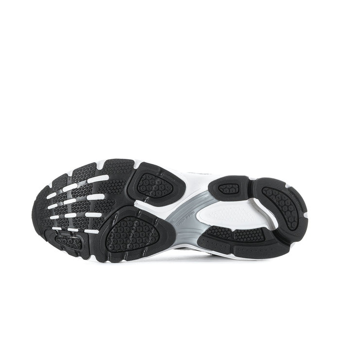 Shoe outsole view with dark tread sections and white midsole platform.