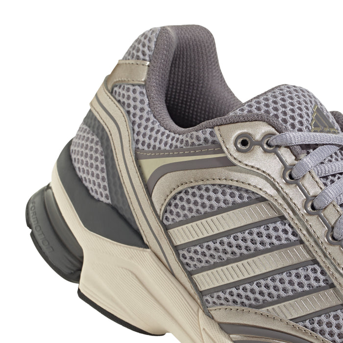 Men's sneaker upper close-up: gray perforated mesh with lace and taupe overlays