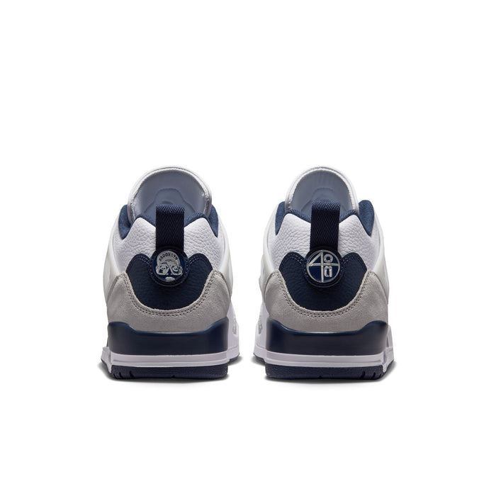 Men's low-top sneakers, rear view with navy heel tabs and cushioned collar