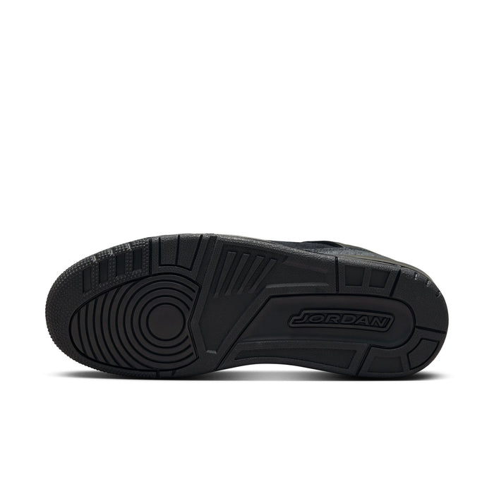 Black low-top sneaker outsole with Jordan logo and deep tread pattern