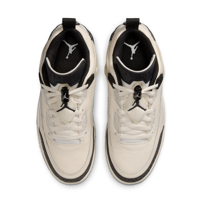 Women’s cream lace-up sneakers with black tongue lining and Jumpman logo.