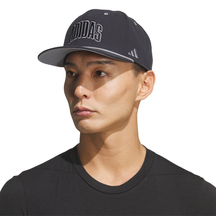 Adidas snapback cap in black on model, curved brim and embroidered Adidas wordmark