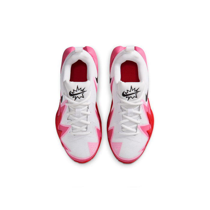 Pair of youth white sneakers with pink lining, lace-up closure, and black logo on tongue