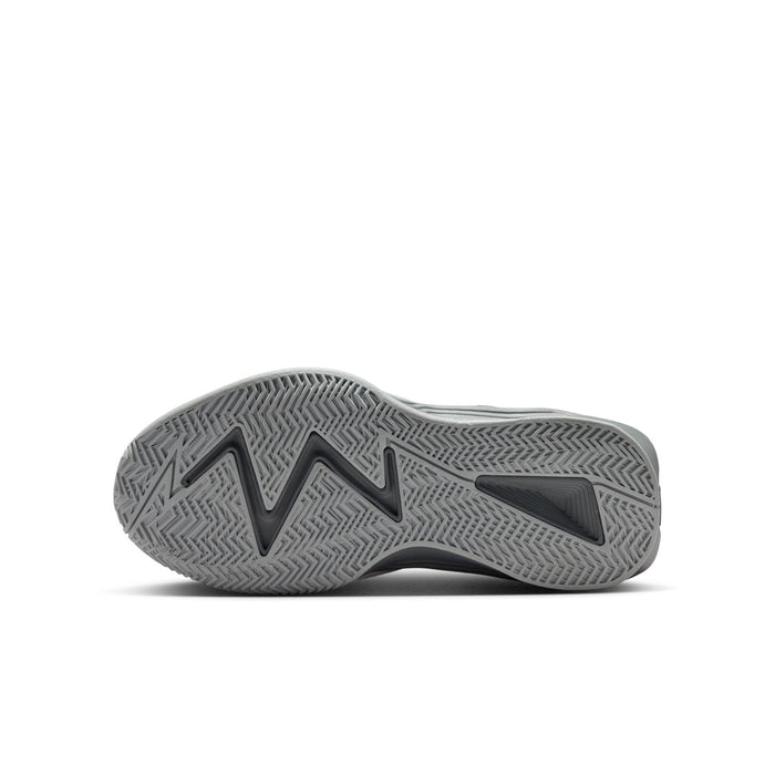 Youth basketball shoe outsole view, textured gray rubber tread