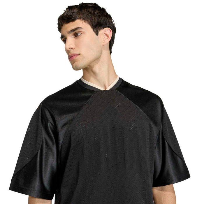 Black mesh stadium tee close-up, V-neck collar and textured fabric pattern