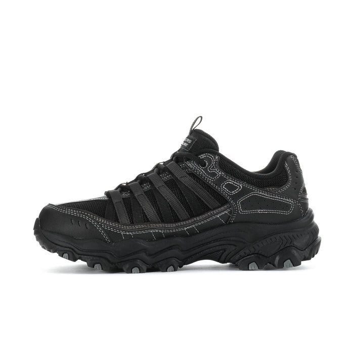 Men's black lace-up trail sneakers with bold midsole and side overlay panels