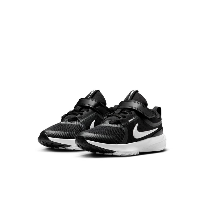 Kids black running sneakers, side view, with white swoosh and white midsole