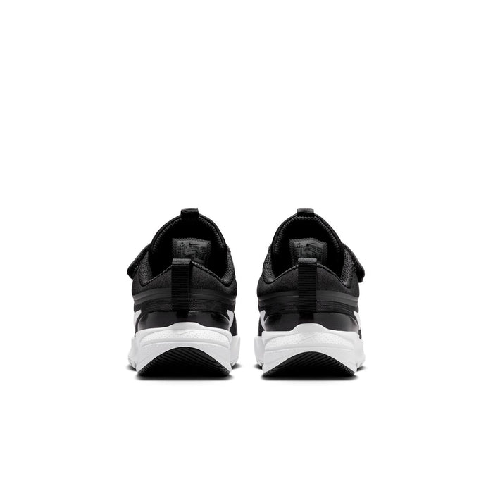 Kids black sneakers rear view with white midsole and cushioned heel