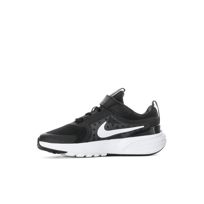 Kids black running sneakers with white swoosh and white midsole