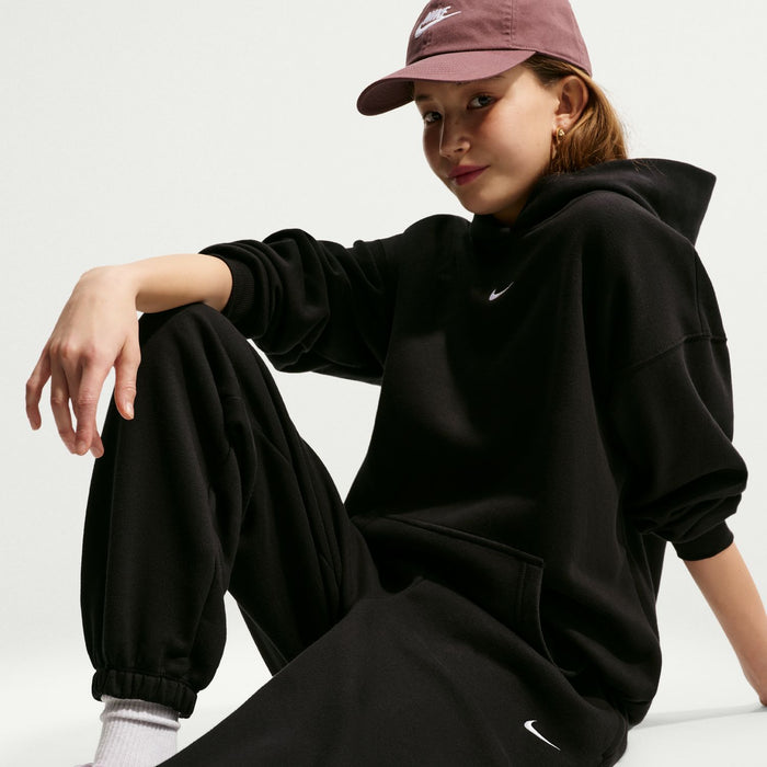Youth black fleece loose pants with elastic waistband and cuffed ankle hems