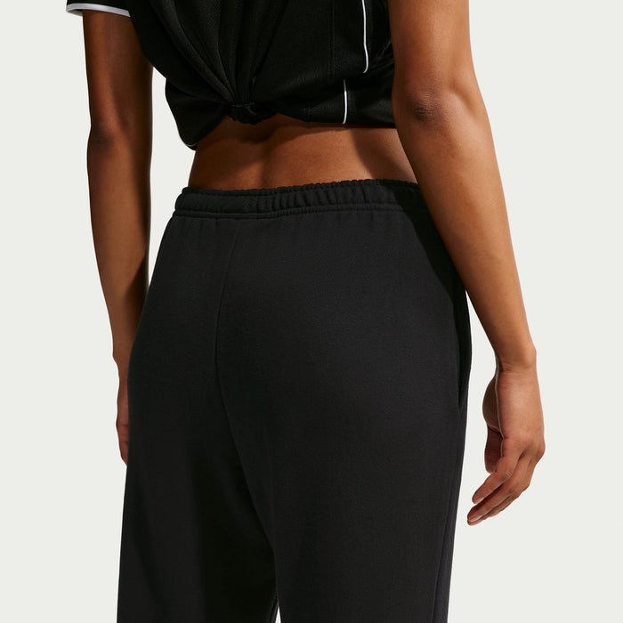 Women's black fleece pants with elastic waistband, side view