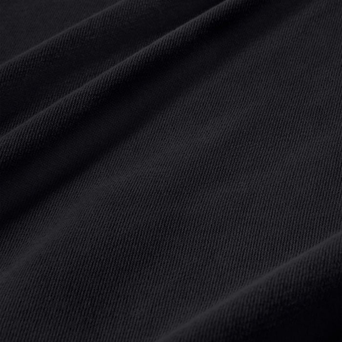 Black fleece hoodie fabric close-up with fine knit texture