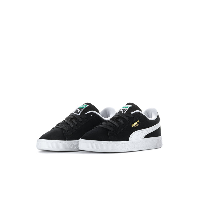 Kids PUMA suede sneakers, black uppers with white midsole and green/yellow accents.