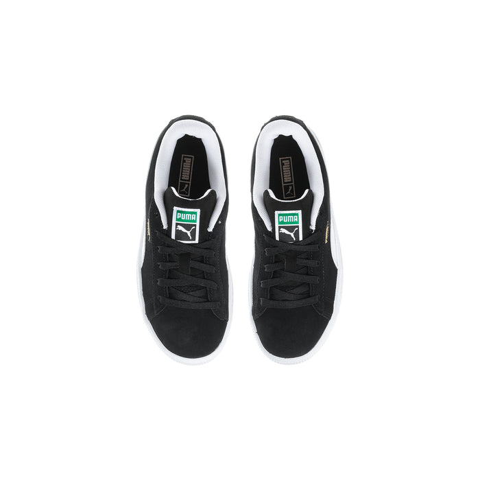 Pair of kids black suede sneakers with white lining and PUMA tongue logo.