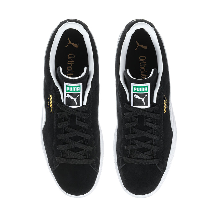 Black suede sneakers, front interior view with lace-up eyelets and branding