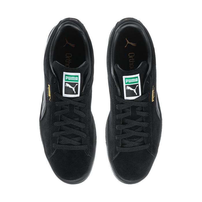 Black suede low-top sneakers front view with lace-up and Puma tongue labels.