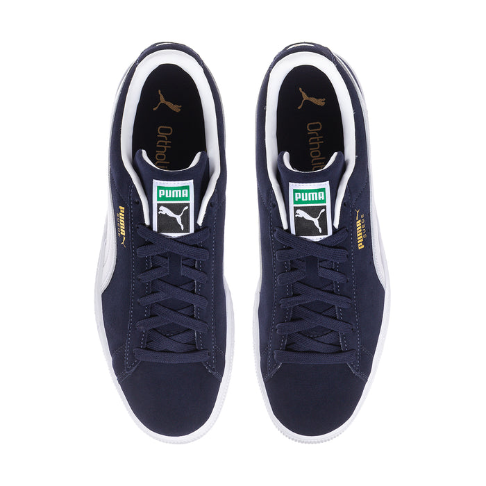Navy suede lace-up sneakers with white Puma logo on tongue and white interior lining