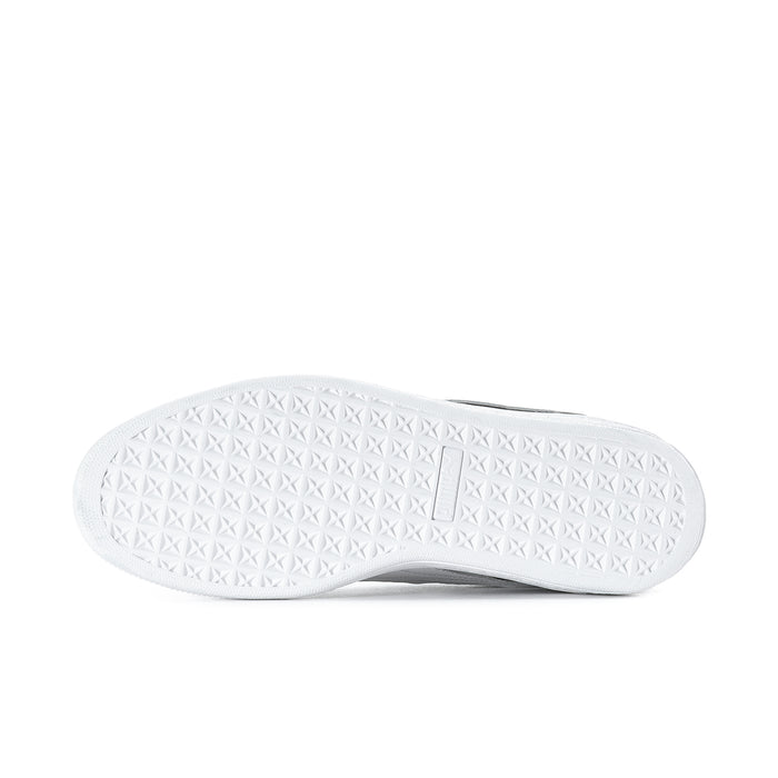 White textured outsole for black suede low-top sneakers with traction pattern