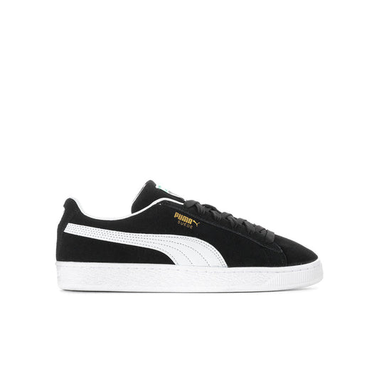 Youth suede sneakers in black with white Puma stripe and lace-up design