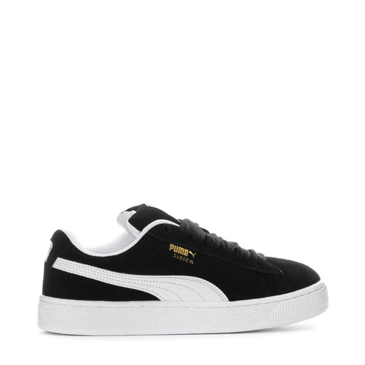 Black suede youth sneakers with white side stripe and textured white sole