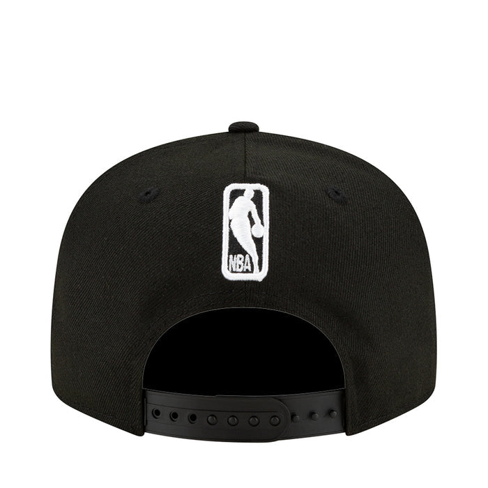 Black baseball cap with white NBA logo patch on front